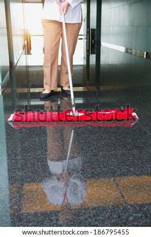 worker is cleaning the floor in an office building