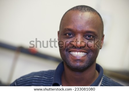 Portrait of happy African worker men indoor