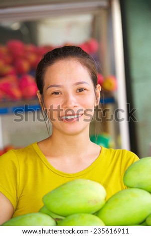 Beautiful asian fruit market seller in Vietnam