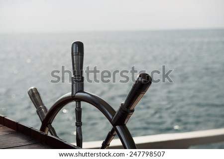One metal steering wheel the boat
