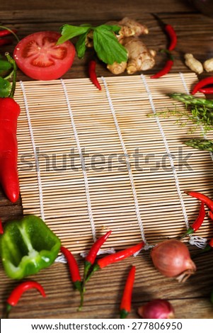 Vegetarian background with asparagus, peppers, onions, tomatoes and ginger for menu. Vertical photo