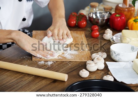 Chef prepare the dough for home made pizza