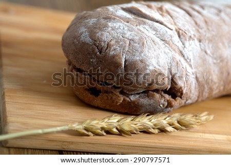 Organic rural baked rustic rye bread on table. Macro photo