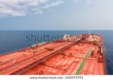 Crude oil carriers red deck with pipeline. Unusual perspective - stock photo.