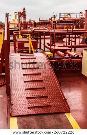 Safety ladder on deck of a crude oil tanker - stock photo