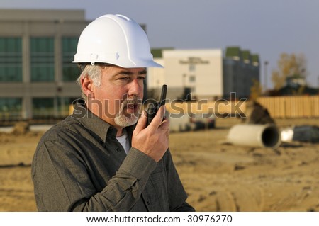 Construction worker on two way radio