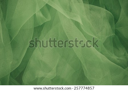 Close-up of plastic net. Artistic texture or background. Abstract plastic net texture. Background in green.