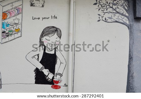 Taipei, Taiwan - 7 February 2015: Painting on the wall outside a Taipei Cafe. In the painting a girl is pouring tea in the kitchen and the words \