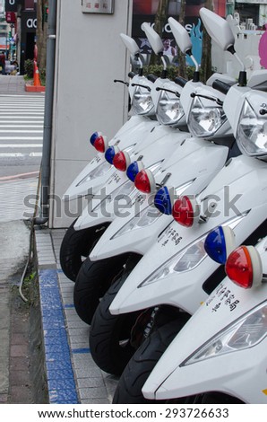 Taipei, Taiwan - 22 February 2015: Row of police bikes/police scooters. Text meaning on scooters: City Police Government, Patrol scooters.
