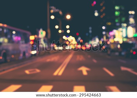 De focused/blur image of city at night. De focused, blurred urban abstract traffic background.