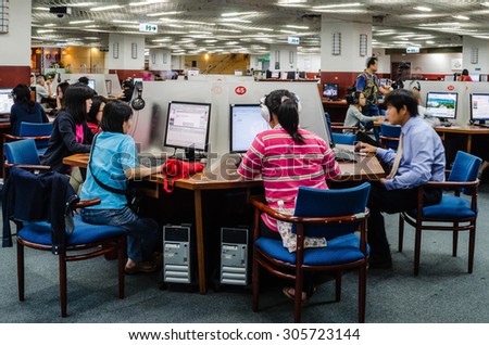 New Taipei City, Taiwan - 30 October 2011: People searching information on internet in National Taiwan Library, the largest public library in Taiwan, a  research center of Taiwan Studies.