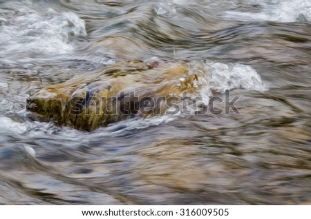 Digital oil painting of creek water flowing through a rock. Motion blur.