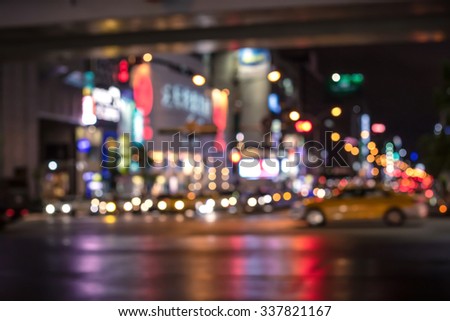 De focused/Blurred image of city street by night. Toned image.