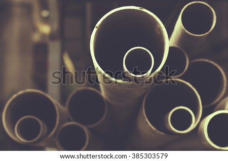 Stacks of PVC water pipes. Abstract circular water pipe.  Selective focus.Toned image.