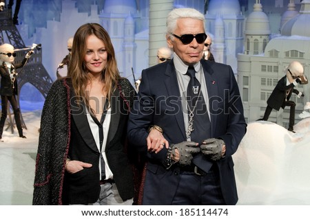 PARIS, FRANCE - NOVEMBER 9, 2011 - Vanessa Paradis and Karl Lagerfeld during the light period of Paris for Christmas. They inaugurated the store windows of the department store Printemps Haussmann.