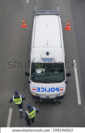 PARIS, FRANCE - MAY 20, 2014 - French car police doing patrol