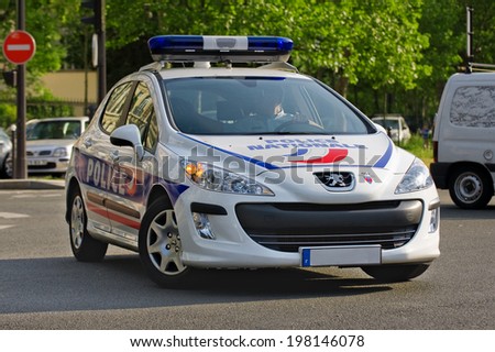 PARIS, FRANCE - MAY 20, 2014 - French car police doing patrol