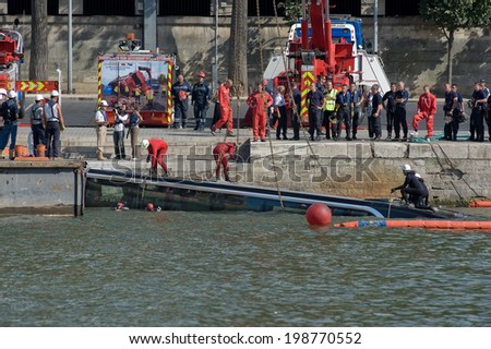 PARIS, FRANCE - JULY 27, 2010 : Austrian bus fell into the Seine at the foot of the Eiffel Tower