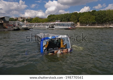 PARIS, FRANCE - JULY 27, 2010 : Austrian bus fell into the Seine at the foot of the Eiffel Tower