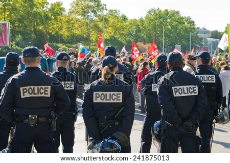 NANTERRE, FRANCE - OCTOBER 10, 2010 : French police in Nanterre in front of the administrative center of the city to prevent spillage during the demonstration against pension reform
