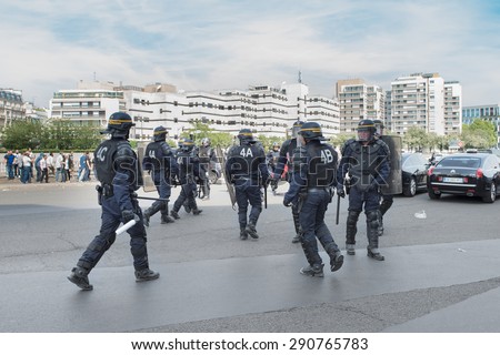 PARIS, FRANCE - JUNE  25, 2015 :  French police (riot squad) try to control the protest of the taxi drivers against the service Ubber Pop at the Porte Maillot.
