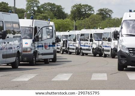 PARIS, FRANCE - JUNE  25, 2015 :  French police vans parked around Porte Maillot to transport Riot Squad because of the protest of the taxis against the service Ubber Pop.