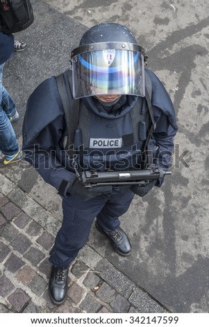 PARIS, FRANCE - NOVEMBER 18, 2015 : French policeman on duty after the terrorist attacks in Paris on 13 November 2015.
