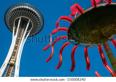 The Space Needle at Seattle Center with glass artworks at the foreground