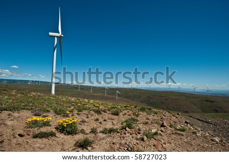 Giant wind turbines on a mountain ridge