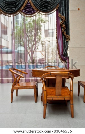 A Chinese living room with bamboo table and chairs