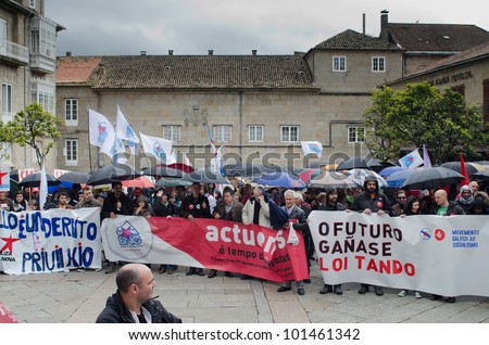 SPAIN - MAY 1: Groups of people demonstrated by Labor Day, where unions protest against the various social cuts approved by the Government of Spain, held on MAY 1, 2012 in Pontevedra, Spain.