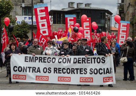 SPAIN - MAY 1: Groups of people demonstrated by Labor Day, where unions protest against the various social cuts approved by the Government of Spain, held on MAY 1, 2012 in Pontevedra, Spain.