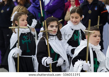 PONTEVEDRA - APRIL 5: Group of unidentified children parading in a Catholic processions held on the occasion of Easter April 5, 2012 in Pontevedra, Galicia, Spain.