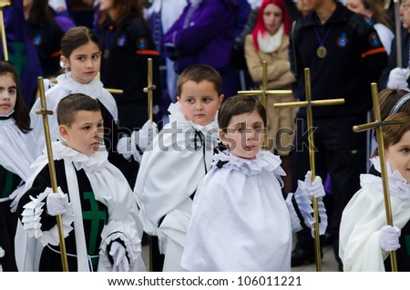 PONTEVEDRA - APRIL 5: Group of unidentified children parading in a Catholic processions held on the occasion of Easter April 5, 2012 in Pontevedra, Galicia, Spain.