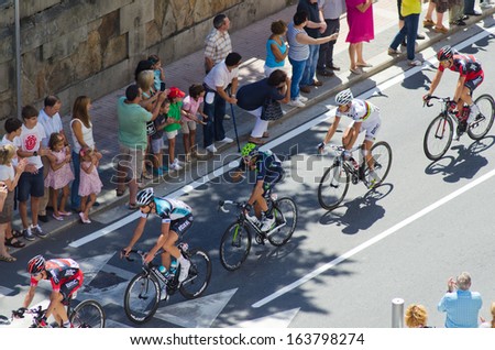 PONTEVEDRA - AUGUST 26: Detail of the peloton of cyclists in urban stage of the Tour of Spain, on August 26, 2013, through the streets of the city of Pontevedra (Spain)