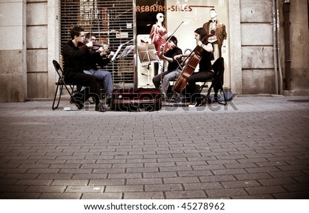 PONTEVEDRA, SPAIN - JULY 25: A string quartet played in the street in the music days of the feast of \'Santiago Apostol\', July 25, 2007 in Pontevedra, Spain.