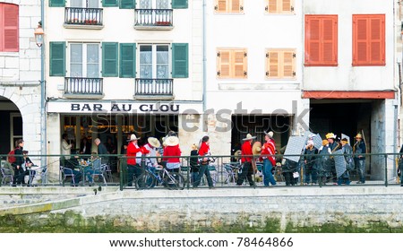 BAYONNE, FRANCE - MARCH 12: Groups of people having fun in the streets   during carnival celebrations in Bayonne, March 12, 2011, Bayonne, France.