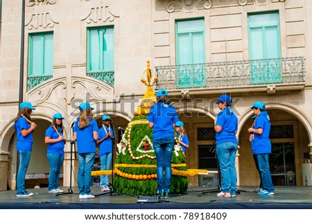 PONTEVEDRA, SPAIN - MAY 1: Unidentified children sing protest songs on a float at the annual first of May festivities on May 1, 2011 in Pontevedra, Spain.