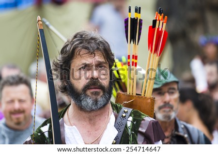 PONTEVEDRA, SPAIN - SEPTEMBER 6, 2014: An archer with arrows and clothed in time, in medieval festival held each year in the historical district of the city.