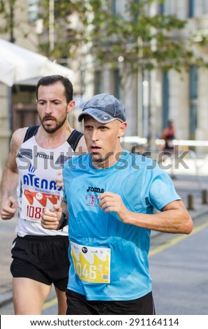 Pontevedra, SPAIN - OCTOBER 19, 2014: Detail of participants in the popular race XVIII Ltd. Half Marathon 2014, held on the streets of the city.