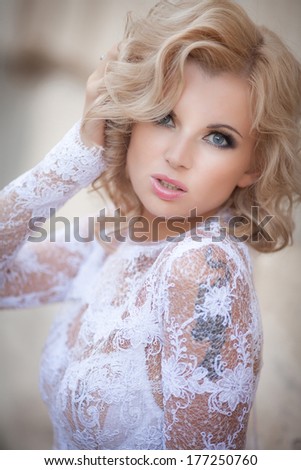 Vogue sexy blonde woman portrait, beautiful sensual girl in white wedding dress, fashion beauty model outdoors. Retro woman portrait. Luxury. Glamour woman with blonde curly hair and bright makeup.
