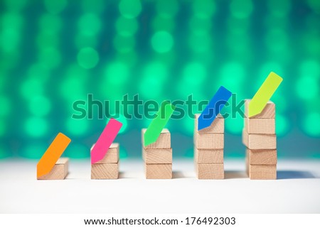 Wood graph with green background and colorful sticker