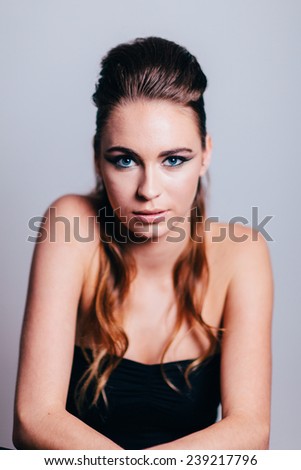 Studio Portrait of Young Attractive Woman slight smile