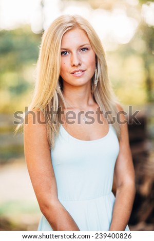 portrait of beautiful young blonde woman hair close up slight smile
