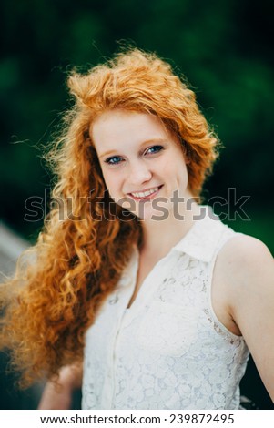 Attractive Young Female Redhead, slight smile, vertical variation