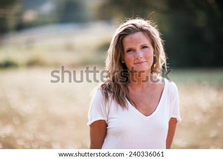 Beautiful Blonde Young Woman slight smile