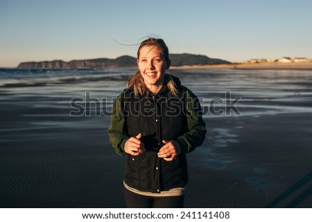Female Runner on the Beach at Sunset smiling run