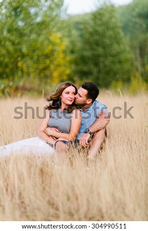 Beautiful Couple in Wheat Field Guy Kissing Cheek Sitting