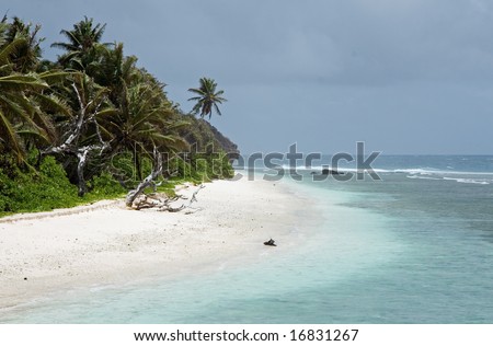 Rain and sun on a beach of La Digue, Seychelles
