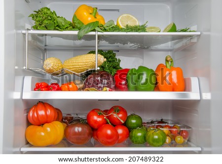 Part of a refrigerator full of different food products